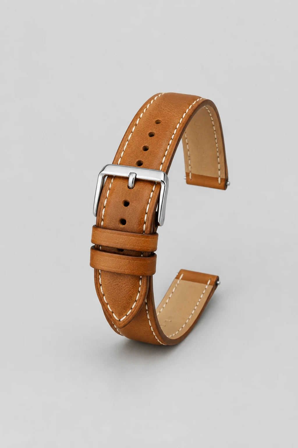 Tan leather watch strap with steel buckle